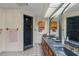 Spacious bathroom featuring double sinks, tiled floors, a shower, and plenty of counter space at 3634 Apfel Rd, Wesley Chapel, FL 33543