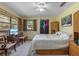 Cozy bedroom with carpet, ceiling fan, and natural light from the window at 3634 Apfel Rd, Wesley Chapel, FL 33543