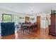 Dining room with hardwood floors, chandelier, and view of the backyard at 3634 Apfel Rd, Wesley Chapel, FL 33543