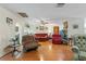 Living room featuring hardwood floors, skylight, and a fireplace at 3634 Apfel Rd, Wesley Chapel, FL 33543