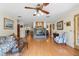 Bright living room with hardwood floors, fireplace, and comfortable seating at 3634 Apfel Rd, Wesley Chapel, FL 33543