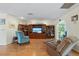 Bright living room with hardwood floors and a large entertainment center at 3634 Apfel Rd, Wesley Chapel, FL 33543