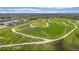 Breathtaking aerial view of the community, showcasing lush green spaces, walking trails, and beautiful homes at 6243 Plateau Ct, Bradenton, FL 34203