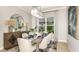 Formal dining room with stylish decor, a decorative mirror, a modern light fixture, and seating for six at 6243 Plateau Ct, Bradenton, FL 34203