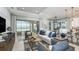 Open-concept living room featuring a smooth flow between the kitchen, dining, and outdoor living spaces at 6243 Plateau Ct, Bradenton, FL 34203