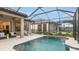 Relaxing screened-in pool area with lounge chairs and elegant tilework at 6243 Plateau Ct, Bradenton, FL 34203