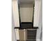 Close up shot of the bar, cabinets, and wine cooler in the kitchen at 8111 Lakewood Main St # 207, Lakewood Ranch, FL 34202