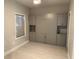 Neutral bedroom with built-in wardrobe and shelving, maximizing space and storage solutions at 8111 Lakewood Main St # 207, Lakewood Ranch, FL 34202
