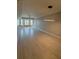 Spacious living room with tiled floors, recessed lights, and large windows at 8111 Lakewood Main St # 207, Lakewood Ranch, FL 34202