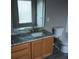 Clean bathroom featuring a granite countertop and vinyl flooring at 6339 Magnolia Trails Ln, Gibsonton, FL 33534
