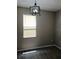 Bedroom with laminate floors, light fixture, and window at 6339 Magnolia Trails Ln, Gibsonton, FL 33534