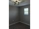 Bedroom features a window and modern lighting fixture at 6339 Magnolia Trails Ln, Gibsonton, FL 33534
