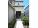 Inviting front entrance with covered porch and neutral-tone exterior at 6339 Magnolia Trails Ln, Gibsonton, FL 33534