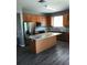 Spacious kitchen features stainless appliances and a center island at 6339 Magnolia Trails Ln, Gibsonton, FL 33534