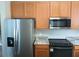 View of kitchen with stainless steel appliances and ample cabinet space at 6339 Magnolia Trails Ln, Gibsonton, FL 33534
