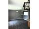 Spacious living room features modern lighting fixtures and laminate flooring at 6339 Magnolia Trails Ln, Gibsonton, FL 33534