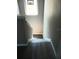 View of a staircase with vinyl flooring and overhead lighting at 6339 Magnolia Trails Ln, Gibsonton, FL 33534