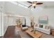 Cozy living room with a ceiling fan, hardwood floors, and an open floor plan at 3019 Woodpine Ln, Sarasota, FL 34231