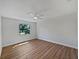 This bedroom has plenty of natural light and new wood floors at 3010 Pine Club Dr, Plant City, FL 33566