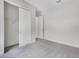 Bright bedroom features plush carpet, a walk-in closet, and neutral paint, creating a calming atmosphere at 5954 Caldera Ridge Dr, Lithia, FL 33547