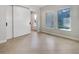 Bright room showcasing tile floors, a sliding door, and two windows with privacy blinds at 5954 Caldera Ridge Dr, Lithia, FL 33547