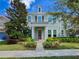 Attractive two-story home with lush landscaping, a red front door, and inviting curb appeal at 5954 Caldera Ridge Dr, Lithia, FL 33547