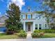 Attractive two-story home with lush landscaping, a red front door, and inviting curb appeal at 5954 Caldera Ridge Dr, Lithia, FL 33547
