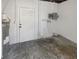 Unfinished basement featuring a white door, water heater, and electrical panel at 8340 75Th Pl, Seminole, FL 33777