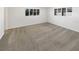 Bright bedroom with neutral carpet, multiple windows, and modern trim at 8340 75Th Pl, Seminole, FL 33777