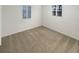 Neutral bedroom with two windows and light brown carpet at 8340 75Th Pl, Seminole, FL 33777