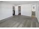 Bright living room with neutral carpet adjacent to kitchen, bathroom and walk in closet at 8340 75Th Pl, Seminole, FL 33777