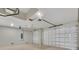 A brightly lit garage with two doors and a smooth floor at 15741 Autry Cir, Port Charlotte, FL 33981