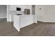 This kitchen includes a center island with quartz countertops at 15741 Autry Cir, Port Charlotte, FL 33981