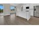Kitchen boasts stainless steel appliances and a large island, perfect for entertaining at 15741 Autry Cir, Port Charlotte, FL 33981
