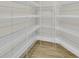 Walk-in pantry with ample shelving for organized storage at 15741 Autry Cir, Port Charlotte, FL 33981