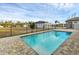 A beautiful pool and deck with a view of the surrounding neighborhood at 15741 Autry Cir, Port Charlotte, FL 33981