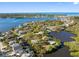 Scenic aerial view of waterfront homes surrounded by natural beauty and tranquil waterways at 5275 Miller Bayou Dr, Port Richey, FL 34668