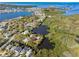 Aerial view of a property surrounded by waterways and lush greenery, with a red boundary line around the land at 5275 Miller Bayou Dr, Port Richey, FL 34668