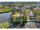 Waterfront home situated on private parcel surrounded by mature trees with dock and bay access at 5275 Miller Bayou Dr, Port Richey, FL 34668