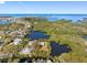 Aerial view of a waterfront property, defined by a red border, surrounded by canals and lush vegetation at 5275 Miller Bayou Dr, Port Richey, FL 34668