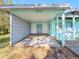 A spacious carport with a decorative block wall and front entrance at 5275 Miller Bayou Dr, Port Richey, FL 34668