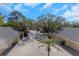 An aerial view of the property with lots of trees at 13794 Marseilles Ct, Clearwater, FL 33762