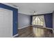 Bedroom features hardwood flooring, neutral paint and trim, and a ceiling fan at 13794 Marseilles Ct, Clearwater, FL 33762