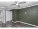 Bedroom with hardwood floors, neutral color, and a ceiling fan at 13794 Marseilles Ct, Clearwater, FL 33762