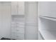 Well-organized walk-in closet offering shelving, drawers, and ample storage space at 13794 Marseilles Ct, Clearwater, FL 33762