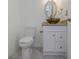 Modern half bathroom with a vessel sink, granite countertop, and updated fixtures at 13794 Marseilles Ct, Clearwater, FL 33762