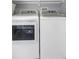 Laundry room showcasing a modern, side-by-side washer and dryer at 13794 Marseilles Ct, Clearwater, FL 33762