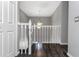 A naturally lit loft area with hardwood floors and views of the first floor at 13794 Marseilles Ct, Clearwater, FL 33762