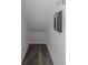 An unfinished storage room with wood-look vinyl flooring at 13794 Marseilles Ct, Clearwater, FL 33762