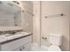 Updated bathroom with granite countertop and marble tile shower at 7001 Heath Dr, Port Richey, FL 34668